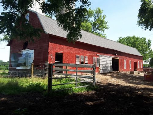 red barn with shingle roofing